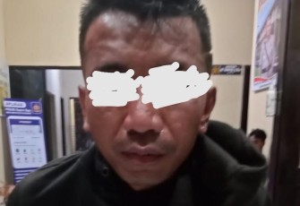 Tersangka OK alias Ander pelaku penganiaya dengan menggunakan sajam