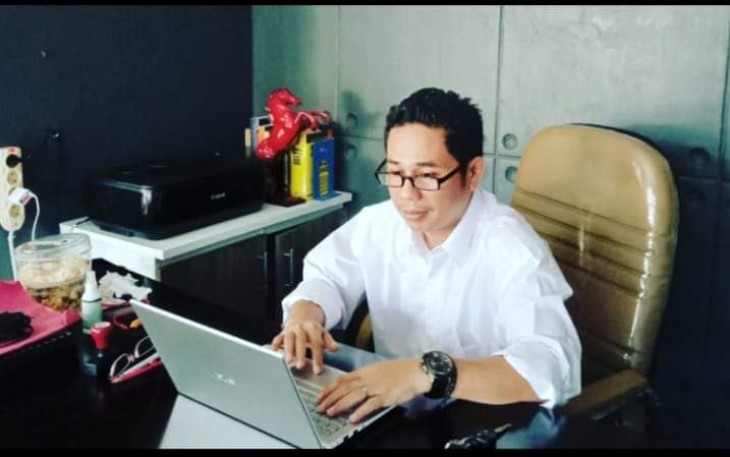 Elfahmi Lubis 