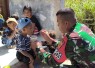 Yonarmed 12 Kostrad saat Gelar Posyandu di Wilayah Perbatasan