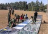 Pemasangan banner penutupan TMMD
