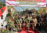 Pengguntingan pita sebagai simbol peresmian jalan beton