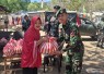 Jumat Berkah Yonarmed 12 Kostrad, Ringankan Beban Warga Kurang Mampu di Kampung Kelapa 2