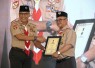 Menteri Pendidikan Dasar dan Menengah (Mendikdasmen), Abdul Mu’ti, menerima tanda penghargaan Gerakan Pramuka berupa Lencana Darma Bakti